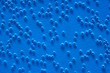 Photo: Air bubbles in water on blue background Air bubbles in water on blue background