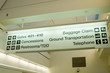 Direction signs in an airport terminal for travelers Direction signs in an airport terminal for travelers