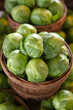 Brussel sprouts for sale in a basket on a open air market stall