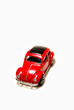Red sedan matchbox toy car on white background.