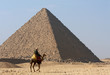 Bedouin on camel near of pyramid in Egypt