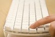 a finger on a keyboard