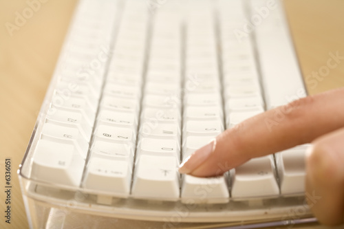 Photo: a finger on a keyboard a finger on a keyboard