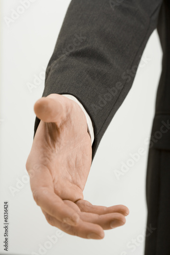 Photo: a businessman hand a businessman hand