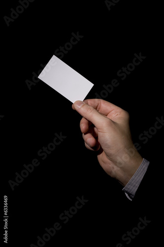 Photo: a businessman holding a business card 2 a businessman holding a business card 2