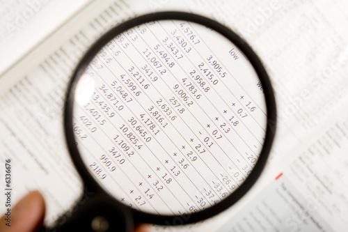 Photo: a magnifying glass, financial magazine2 a magnifying glass, financial magazine2
