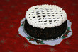 sweet chocolate cake served on the red christmas tablecloth