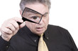Mature Man with Magnifying Glass