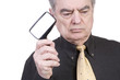 Mature Man with Magnifying Glass