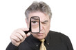 Mature Man with Magnifying Glass