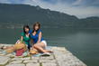 Woman making a picnic at the edge of a lake