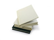 Three hardcover books lying on white background