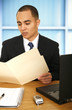 Business Man Reviewing Folder