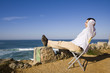 Man sit, enjoying the Ocean view