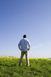 man back, locking away to the blue sky (with copyspace)