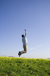a young man jumping high to success