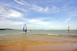 Kite surfing and windsurfing on a lake in Portugal