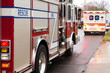 Fire truck and ambulance on side of road.