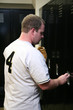 Ball Player Opening Locker After Game