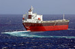Cargo ship balk carrier maks turn on the sea surface