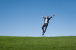 Businessman jumping in the air