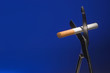 Cutting a cigarette. The concept of quitting smoking.
