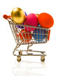 Many multi-coloured Easter eggs in the small store cart.