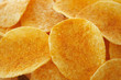Crispy golden brown potato chips (shallow depth of field)