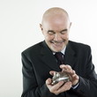 man senior hoding a piggy bank