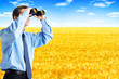 business man with binoculars looking to the future. business man with binoculars looking to the future.