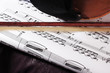Composition of music notes with string of violin