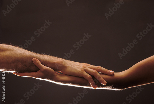 Photo: Woman and man's hands entwined, symbol of agreement, wedding 03 Woman and man's hands entwined, symbol of agreement, wedding 03