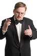 Young  conductor in black tuxedo, isolated on white