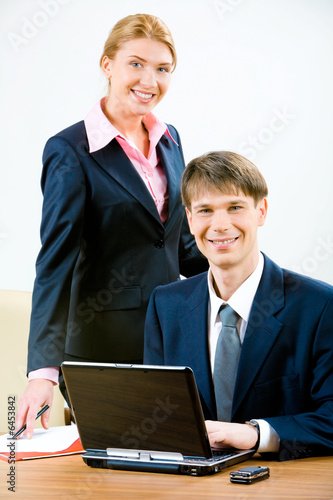 Image of business man and attractive secretary 
