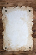 Old paper tacked to a wood wall