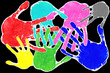 Hand prints in many colours with interlocking fingers on black