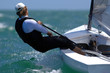 Photo : A lone sailor enjoys an outing in a small boat.