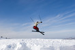 Snow Skier Jumping Against Blue Sky in winter Tien Shan Snow Skier Jumping Against Blue Sky in winter Tien Shan