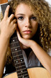 Young teenage woman with a guitar 