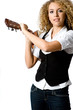 A pretty young woman with acoustic guitar on shoulder