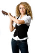 A pretty young woman with acoustic guitar on shoulder