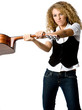 An attractive young female musician swinging an acoustic guitar