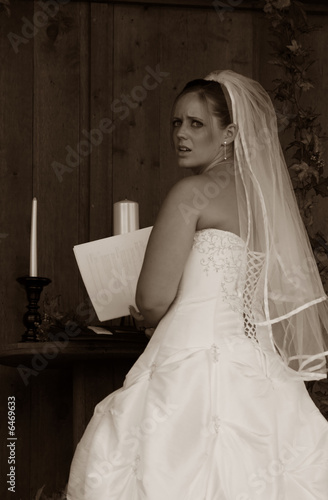 Photo: A nervous bride prepares for the wedding ceremony. Sepia Tones A nervous bride prepares for the wedding ceremony. Sepia Tones