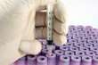 lab technician doing research with syringe
