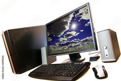 Photo: A computer desktop setup on a white isolated background. A computer desktop setup on a white isolated background.