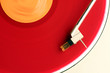 close-up of red album on turntable