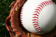 A baseball glove with a baseball