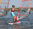 Photo: Girl learning to windsurf in warm waters Girl learning to windsurf in warm waters