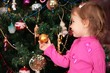 little girl and christmas fir