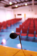 Photo: A microphone in an empty auditorium A microphone in an empty auditorium